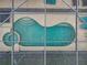 Aerial view of kidney shaped pool and spa at 426 Orange Cosmos Blvd, Davenport, FL 33837