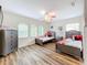 ' bedroom with twin beds, wood flooring, and plenty of light at 426 Orange Cosmos Blvd, Davenport, FL 33837