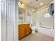 Clean bathroom with tub, shower, and wood vanity at 426 Orange Cosmos Blvd, Davenport, FL 33837