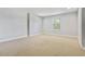 Simple bedroom with carpet and a window at 26012 Splendid Meadow Ct, Astatula, FL 34705
