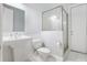 White bathroom with pedestal sink, toilet and shower at 26012 Splendid Meadow Ct, Astatula, FL 34705