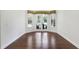 Breakfast room with hardwood floors and French doors leading to the backyard at 26012 Splendid Meadow Ct, Astatula, FL 34705