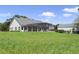 White farmhouse sits on a large grassy lot with barn at 26012 Splendid Meadow Ct, Astatula, FL 34705