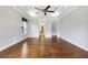 Main bedroom with hardwood floors and ceiling fan at 26012 Splendid Meadow Ct, Astatula, FL 34705