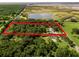 Aerial view highlighting a home's location on a spacious lot at 26012 Splendid Meadow Ct, Astatula, FL 34705