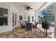 Covered patio with paver floor and outdoor seating at 26012 Splendid Meadow Ct, Astatula, FL 34705