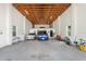 Spacious garage with high ceilings, ample space for multiple vehicles and storage at 26012 Splendid Meadow Ct, Astatula, FL 34705