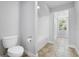 Bathroom with toilet, bathtub, and window at 26012 Splendid Meadow Ct, Astatula, FL 34705