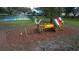 Community playground and recreation area with playset at 10643 Grand Oaks Blvd, Oxford, FL 34484