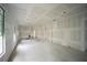 Unfinished interior room showing open floor plan and ample natural light at 10593 Grand Oaks Blvd, Oxford, FL 34484