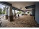 Covered patio overlooking the pool with comfortable seating at 10593 Grand Oaks Blvd, Oxford, FL 34484