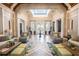 Bright and spacious community lobby with comfortable seating areas at 10593 Grand Oaks Blvd, Oxford, FL 34484