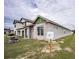 Unfinished block home exterior with a gray color scheme at 10593 Grand Oaks Blvd, Oxford, FL 34484