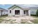 New construction home with block exterior and a modern design at 10619 Grand Oaks Blvd, Oxford, FL 34484