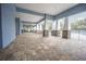 Covered patio with seating areas and pool access at 10619 Grand Oaks Blvd, Oxford, FL 34484