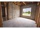 Under construction bedroom featuring a large window and framing at 10619 Grand Oaks Blvd, Oxford, FL 34484