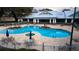 Inviting community pool with surrounding patio and seating at 10607 Grand Oaks Blvd, Oxford, FL 34484