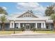 Community clubhouse with gray exterior and stone accents at 10607 Grand Oaks Blvd, Oxford, FL 34484