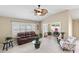 Sunroom with seating area and large windows offering natural light at 2968 Wotring Way, The Villages, FL 32163