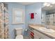 Simple light blue bathroom with shower and toilet at 2968 Wotring Way, The Villages, FL 32163