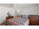 Bedroom with full-size bed and wooden dresser at 2968 Wotring Way, The Villages, FL 32163