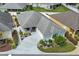 Single-story home with a circular driveway and landscaped yard at 2968 Wotring Way, The Villages, FL 32163