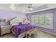 Main bedroom with plush bedding and plantation shutters at 2968 Wotring Way, The Villages, FL 32163