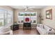 Relaxing sunroom with ample natural light and comfortable seating at 2968 Wotring Way, The Villages, FL 32163