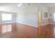 Living room with hardwood floors and ceiling fan at 21701 Queen Mary Ct, Leesburg, FL 34748