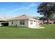 Well-maintained single-story house with a spacious lawn at 21701 Queen Mary Ct, Leesburg, FL 34748