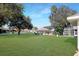 Spacious backyard with green grass, providing ample outdoor space at 21701 Queen Mary Ct, Leesburg, FL 34748