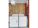 Laundry room with washer, dryer, and pegboard wall at 21701 Queen Mary Ct, Leesburg, FL 34748