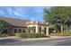 Elegant community clubhouse with Mediterranean-style architecture at 21701 Queen Mary Ct, Leesburg, FL 34748