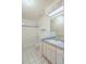 Clean bathroom with tub, vanity, and tiled floor at 21701 Queen Mary Ct, Leesburg, FL 34748