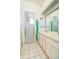 Bathroom with a shower/tub combo, double vanity, and tiled floor at 21701 Queen Mary Ct, Leesburg, FL 34748