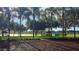 Peaceful lakefront gazebo with scenic views at 21701 Queen Mary Ct, Leesburg, FL 34748