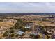 Aerial view of community with pool, tennis courts, and golf course at 15300 Sw 14Th Avenue Rd, Ocala, FL 34473