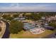 Aerial view showing tennis and pickleball courts, plus a playground at 15300 Sw 14Th Avenue Rd, Ocala, FL 34473