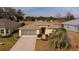 Single-story house with a two-car garage and well-maintained lawn at 15300 Sw 14Th Avenue Rd, Ocala, FL 34473