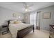 Comfortable bedroom with a ceiling fan and plenty of natural light at 15300 Sw 14Th Avenue Rd, Ocala, FL 34473