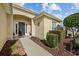 Landscaped front yard with walkway leading to a dark brown door at 15300 Sw 14Th Avenue Rd, Ocala, FL 34473