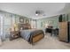 Bright bedroom with a queen-size bed, and a built-in desk at 15300 Sw 14Th Avenue Rd, Ocala, FL 34473