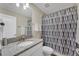 Bathroom with granite countertop and shower/tub combo at 1592 Flange Dr, Davenport, FL 33896