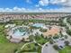 Resort-style community pool with a clubhouse and surrounding landscape at 1592 Flange Dr, Davenport, FL 33896