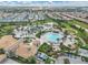 Expansive community pool area with a clubhouse and palm trees at 1592 Flange Dr, Davenport, FL 33896
