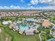 Large community pool complex with multiple pools and a clubhouse at 1592 Flange Dr, Davenport, FL 33896