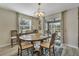 Dining room with wooden table and chairs, access to a patio at 1592 Flange Dr, Davenport, FL 33896