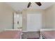 Bedroom with two twin beds and double doors at 1592 Flange Dr, Davenport, FL 33896