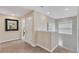 Upstairs hallway with carpet and mirror at 1592 Flange Dr, Davenport, FL 33896