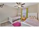 Bedroom with two twin beds and ceiling fan at 1592 Flange Dr, Davenport, FL 33896